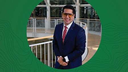Circular photo of John Maldonado on a green background containing topographic map lines