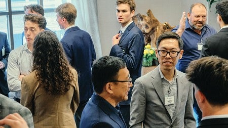 A crowd of students and industry professionals mingle at the UOREIG Networking Event