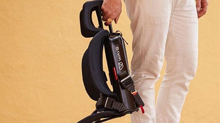 A man holds the lightweight WayB carseat