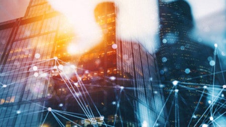 Abstract image of silhouettes reflected in a window against a cityscape background